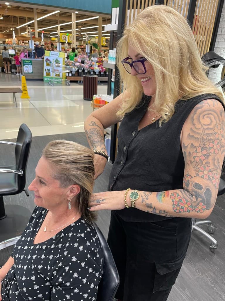 Stylist working with a client in the salon