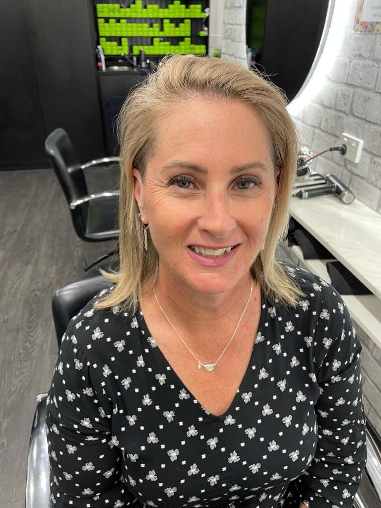 Client with a fresh haircut smiling at the camera
